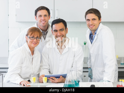 Smiling scientists with tablet PC in the lab Stock Photo
