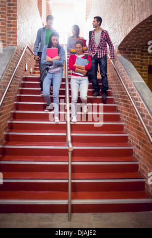 College students walking down stairs in college Stock Photo
