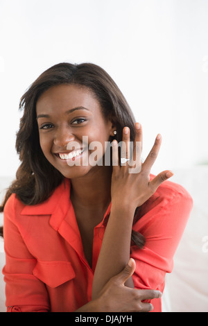 Black woman showing off engagement ring Stock Photo