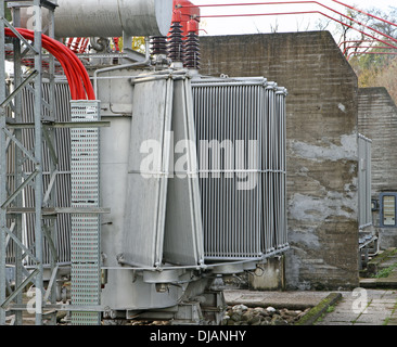 huge electric voltage transformer of a powerful power plant Stock Photo