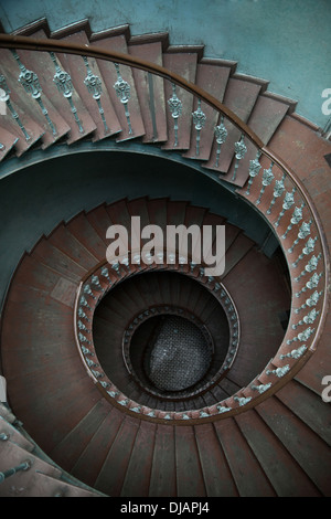 Wooden spiral stairs in tenement house Stock Photo
