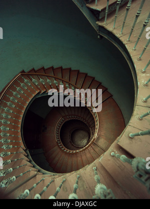 Old wooden spiral stairs in ancient palace Stock Photo