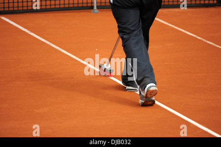 Groundsman cleans the lines on a tennis court, clay tennis court, Bavaria, Germany Stock Photo