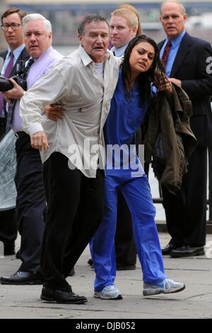 Mila Kunis and Robin Williams on the set of 'The Angriest Man in Brooklyn' in Dumbo, Brooklyn New York City, USA - 26.09.12 Stock Photo