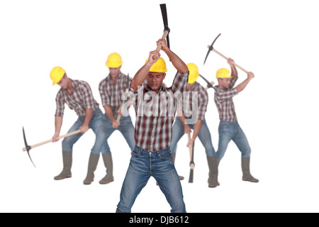 Photo-montage of a laborer using pickaxe Stock Photo