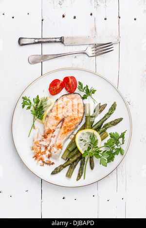 Grilled salmon with asparagus on white plate Stock Photo