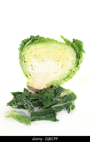 a sliced savoy cabbage against white background Stock Photo