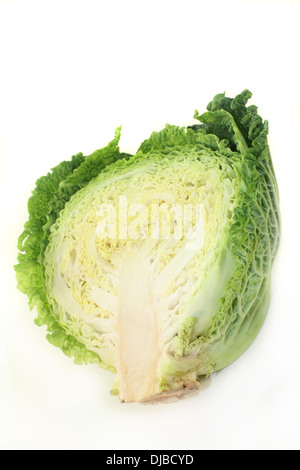 a sliced savoy cabbage against white background Stock Photo