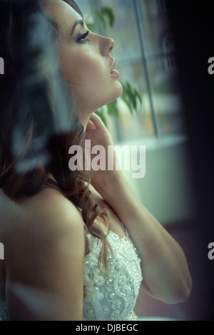 Profile portrait of delightful young bride Stock Photo