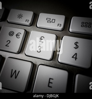 Close up of keyboard showing , €, £ and $ Stock Photo