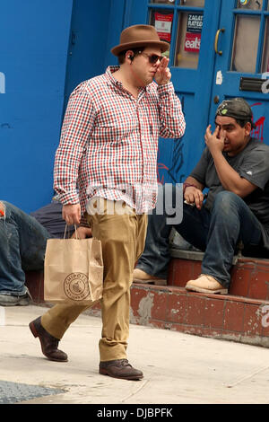Jonah Hill carrying a take-out bag from Chipotle Mexican Grill as he