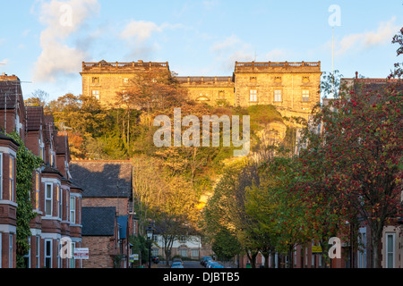 Nottingham Castle, a Ducal mansion, high above local city housing in Autumn evening light, Nottingham, England, UK Stock Photo