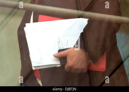 Berlin, Germany. 26th Nov, 2013. SPD parliamentary party leader Frank-Walter Steinmeier arrives at Willy-Brandt-Haus for coalition talks between CDU/CSU and SPD with the coalition agreement in his hands in Berlin, Germany, 26 November 2013. Photo: MAURIZIO GAMBARINI/dpa/Alamy Live News Stock Photo