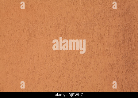 The orange plastered wall closeup Stock Photo