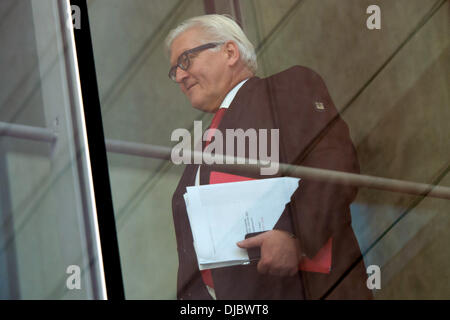 Berlin, Germany. 26th Nov, 2013. SPD parliamentary party leader Frank-Walter Steinmeier arrives at Willy-Brandt-Haus for coalition talks between CDU/CSU and SPD with the coalition agreement in his hands in Berlin, Germany, 26 November 2013. Photo: MAURIZIO GAMBARINI/dpa/Alamy Live News Stock Photo