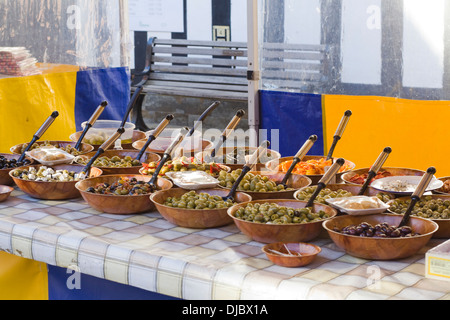Different Types of Olives in Bowls on a Market Stall Stock Photo