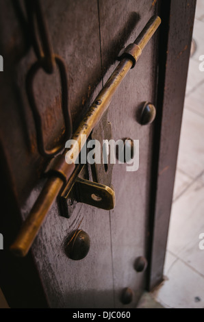 Detail of beautiful hand carved wooden doors and brass hardware at Sheikh Saeed Al-Maktoum House in Shindagha. Dubai, UAE. Stock Photo