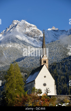 Reformed Church of St. George in front of mountain scenery, Scuol, Lower Engadine, Canton of Grisons, Switzerland, Europe Stock Photo