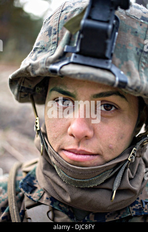 US Marine Pfc. Christina Fuentes Montenegro during the Infantry Integrated Field Training Exercise November 15, 2013 at Camp Geiger, N.C. Montenegro is one of three female Marines to be the first women to graduate infantry training on November 21, 2013. Stock Photo