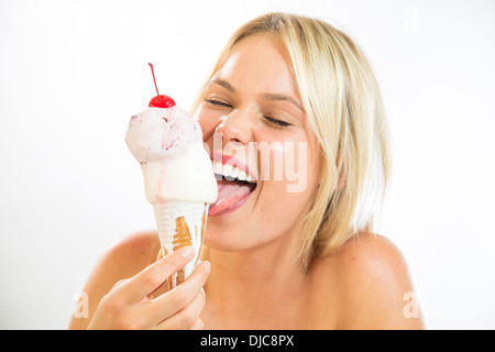 Young woman eating ice cream Stock Photo