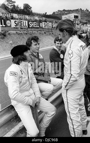 Jackie Stewart with Jackie Oliver and Graham Hill in the Clermont-Ferrand pits. French GP, France 5 July 1970. Stock Photo