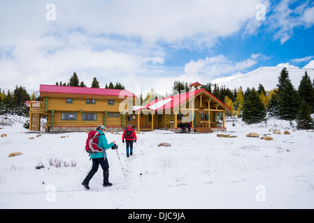 Hikers return to Mount Assiniboine Lodge, Mount Assiniboine Provincial Park, British Columbia, Canada