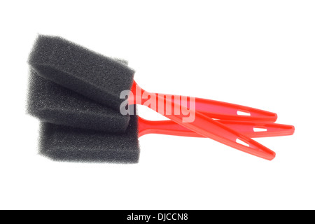 Stack Of Sponge Brushes On White Background Stock Photo