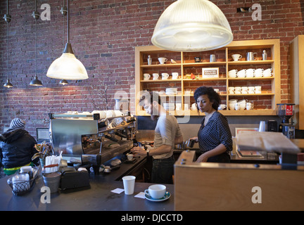 Baristas make sure the coffee tastes good at a cafe in Boston. Stock Photo