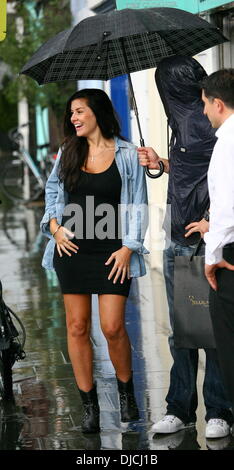 Imogen Thomas showing off her baby bump as she leaves Jak's Restaurant on a rainy day London, England - 25.08.12 Stock Photo