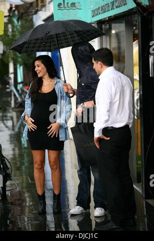 Imogen Thomas showing off her baby bump as she leaves Jak's Restaurant on a rainy day London, England - 25.08.12 Stock Photo
