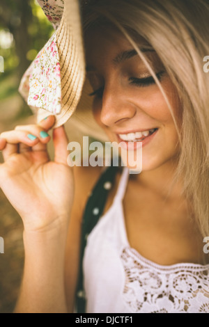 Happy gorgeous blonde wearing straw hat Stock Photo
