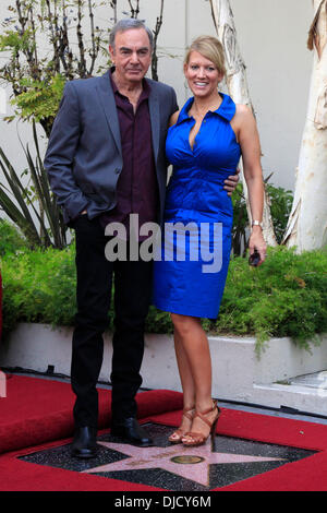 Neil Diamond with his wife Katie McNeil are seen out during a stroll