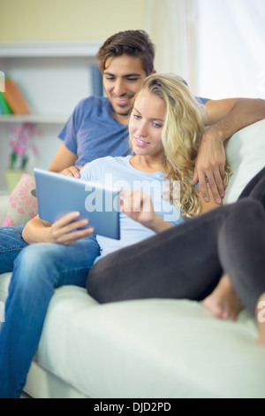Attractive calm couple using a tablet Stock Photo