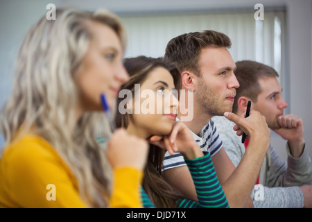 Group of casual students looking away Stock Photo
