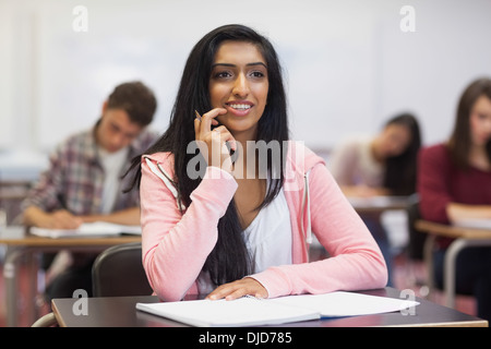 Happy indian student listening in class Stock Photo
