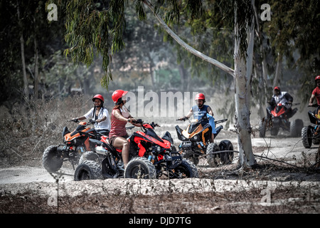 Mixed group of ATV quad bike  riders. Thailand S. E. Asia Stock Photo