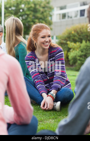 Smiling students taking a break outside on campus Stock Photo