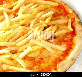 original Neapolitan pizza with French fries and mozzarella and tomato cooked on oven pizzeria in Naples Stock Photo