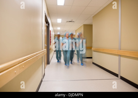 Multiethnic Medical Team Walking In Hospital Corridor Stock Photo