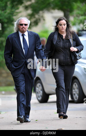 Barry Gibb and his daughter The funeral of Robin Gibb held in his home town of Thame Oxfordshire, England - 08.06.12 Stock Photo