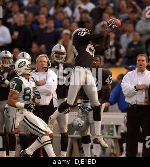 Jan 12, 2003; Oakland, CA, USA; Tory James of the Oakland Raiders intercepts a pass intened for Lawence Coles of the New York Jets during the 4th quarter of their AFC divisional playoff game on Sunday, January 12, 2003 at Network Associates Coliseum in Oakland, Calif. The Raiders won the game 30-10. Stock Photo