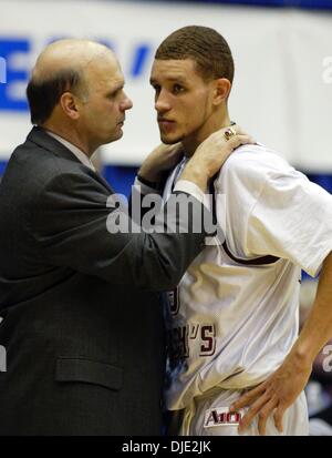 Mar 11, 2004; Dayton, OH; USA; Down by 20 points, Hawks coach PHIL MARTELLI talks to DELONTE WEST in the 2nd half of the Atlantic 10 Championship Quarterfinal Round between the 27-0 Saint Joseph's Hawks and the Xavier Musketeers in Dayton, Ohio, Thursday, March 11, 2004. Xavier defeated the #1 ranked and undefeated St. Joseph's Hawks 87-67. Stock Photo