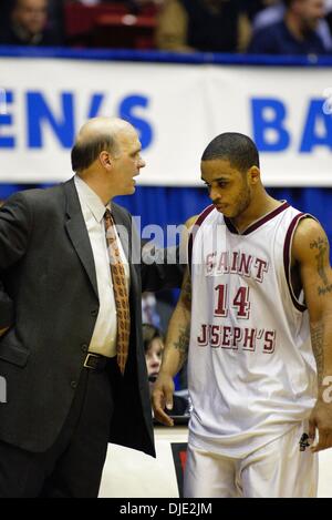 Mar 11, 2004; Dayton, OH; USA; Down by 28 points, Hawks coach PHIL MARTELLI talks to JAMEER NELSON in the 2nd half of the Atlantic 10 Championship Quarterfinal Round between the 27-0 Saint Joseph's Hawks and the Xavier Musketeers in Dayton, Ohio, Thursday, March 11, 2004. Xavier defeated the #1 ranked and undefeated St. Joseph's Hawks 87-67. Stock Photo
