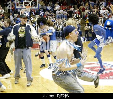 Mar 11, 2004; Dayton, OH; USA; Xavier fans celebrate on the court after the Musketeers defeated the 27-0 undefeated St. Joseph's Hawks in the the Atlantic 10 Championship Quarterfinal Round between the 27-0 Saint Joseph's Hawks and the Xavier Musketeers in Dayton, Ohio, Thursday, March 11, 2004. Xavier defeated the #1 ranked and undefeated St. Joseph's Hawks 87-67. Stock Photo