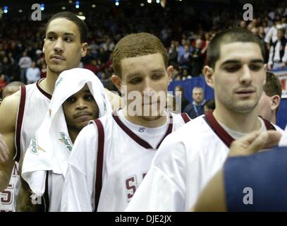 Mar 11, 2004; Dayton, OH; USA; (l-r) Hawks players Dwayne Jones, JAMEER NELSON, DELONTE WEST, and Rob Sullivan congratulate the Musketeers after the Atlantic 10 Championship Quarterfinal Round between the 27-0 Saint Joseph's Hawks and the Xavier Musketeers in Dayton, Ohio, Thursday, March 11, 2004. Xavier defeated the #1 ranked and undefeated St. Joseph's Hawks 87-67. Stock Photo