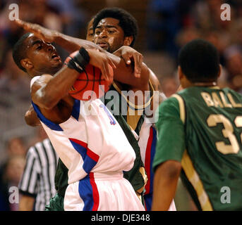 Mar 26, 2004; St. Louis, MO, USA; Kansas' AARON MILES tries to drive Friday night March 26, 2004 at the Edward Jones Dome in St. Louis, Mo. under UAB's GABE KENNEDY during their Sweet 16 game. Stock Photo
