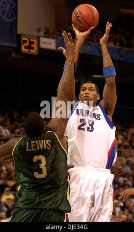 Mar 26, 2004; St. Louis, MO, USA;  Kansas' WAYNE SIMIEN shoots Friday night March 26, 2004 at the Edward Jones Dome in St. Louis, Mo. over UAB's MARQUES LEWIS during their Sweet 16 game. Stock Photo