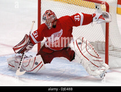 Apr 22, 2004; Detroit, MI, USA; Wings CURTIS JOSEPH makes save (puck just under glove) during the Western Conference semi-finals game between the Detroit Red Wings and Calgary Flames at Joe Louis Arena. The Flames beat the Red Wings 2-1. Stock Photo