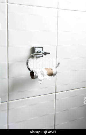 Empty toilet roll on holder.Embarrassing problem, difficult situation. Stock Photo