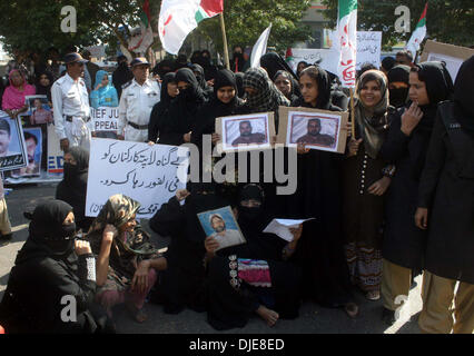 Relatives of missing persons are protesting against kidnapping and missing of their beloveds and demanding to Chief Justice for their recovery, during a demonstration arranged by Muttehida Qaumi Movement on the occasion of Karachi Unrest Case, at Supreme Court Registry in Karachi on Wednesday, November 27, 2013.